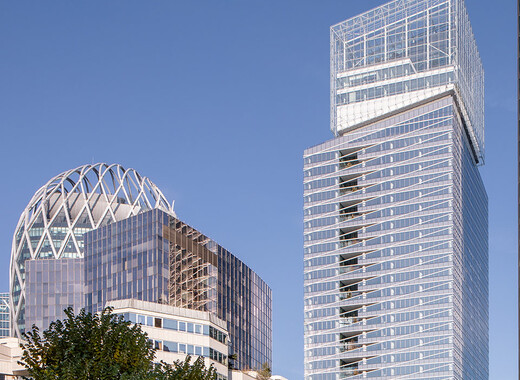 Building facade with smart windows from left to right on a large modern glass building.