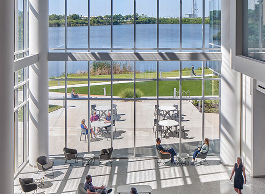 SageGlass Smart Windows in atrium with people enjoying the daylight and views.