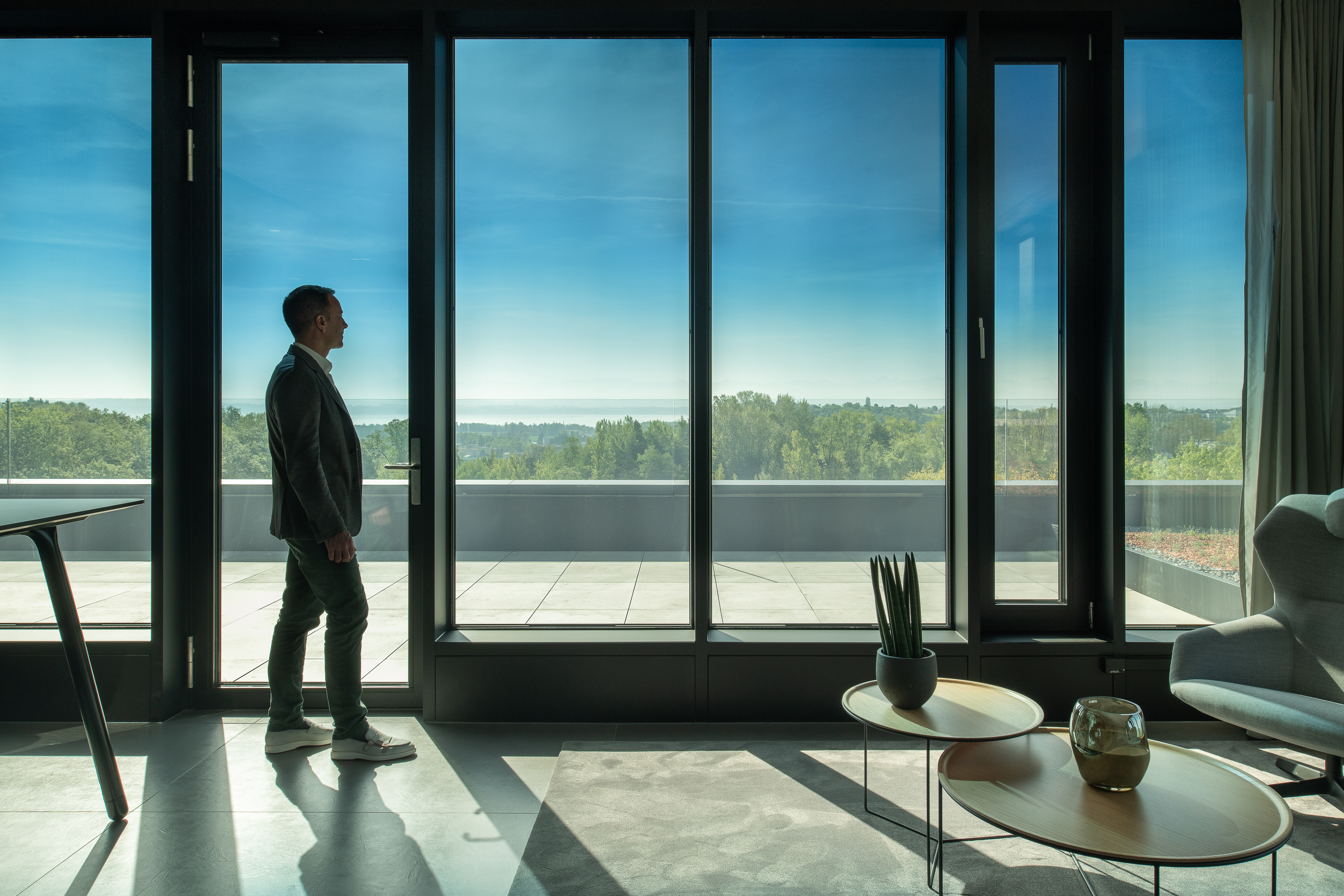 Man looking out SageGlass Harmony Glass