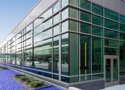 Building with smart windows from left to right on a large modern glass building.