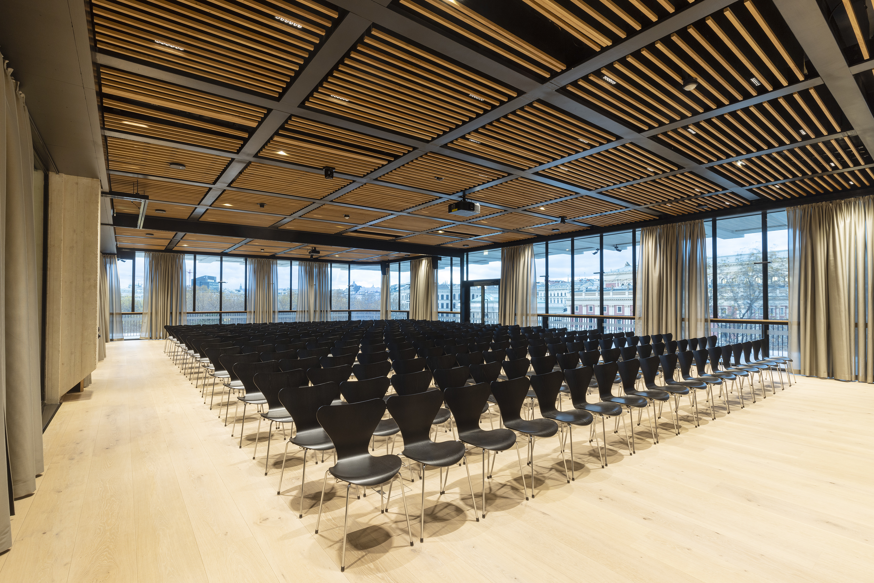 View from inside the building into a meeting room. The SageGlass glazing is tinted.
